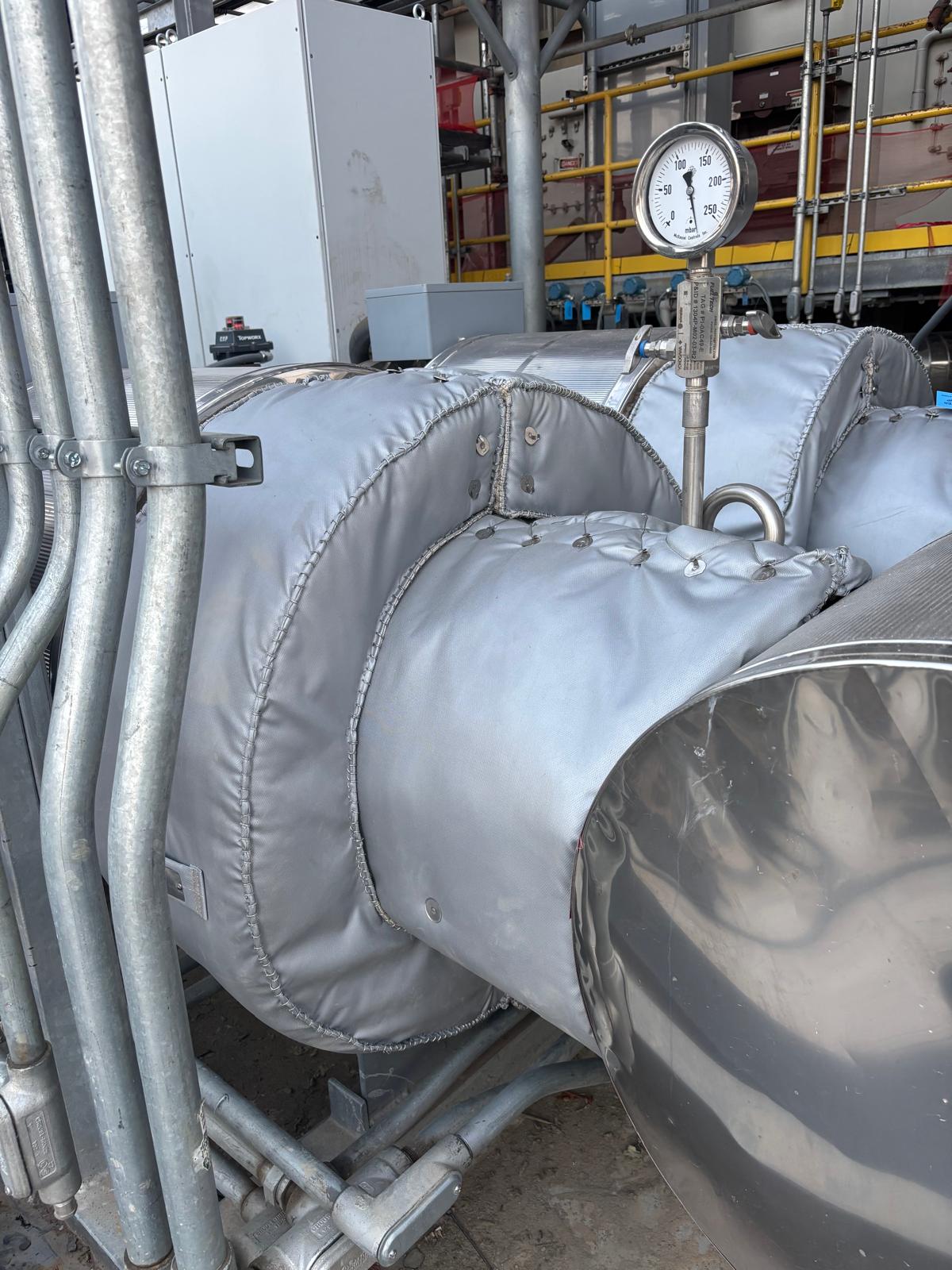 Heat exchanger insulation blanket system at refinery